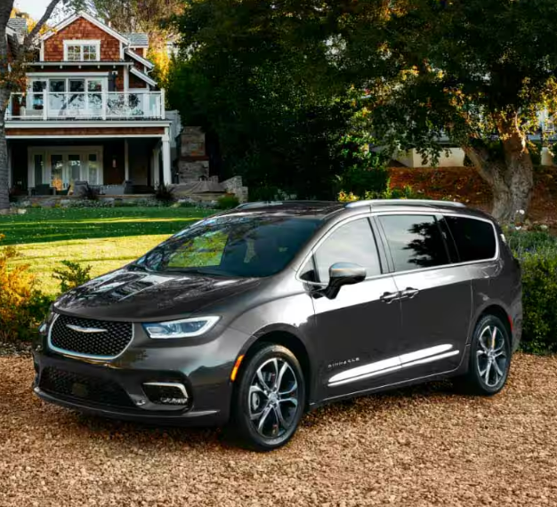 2024 Chrysler Pacifica parking near a tree with side view