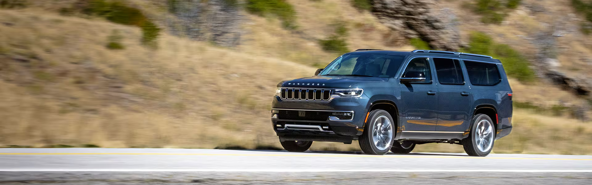 2024 Jeep Wagoneer running with side view Banner