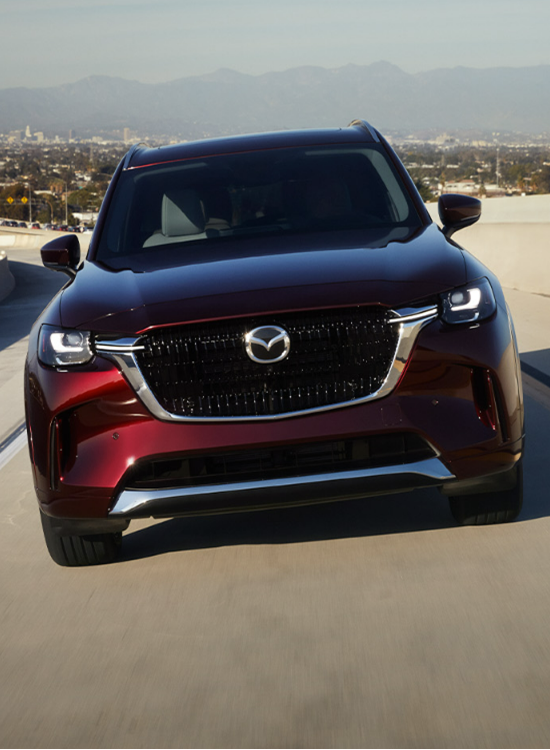 2024 Mazda CX-90 running with front view