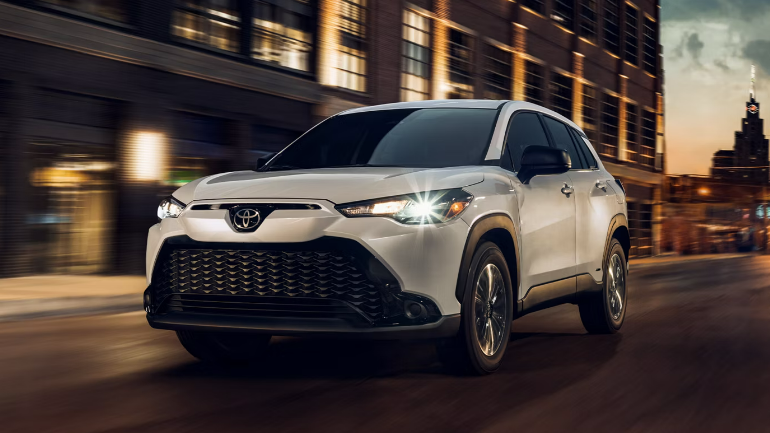 2024 Toyota Corolla Cross in white running on the street