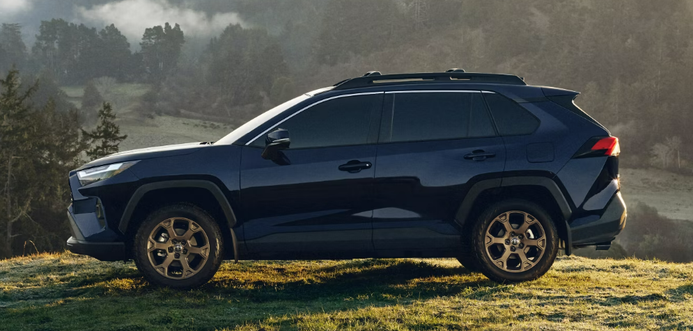 2024 Toyota RAV4 with backdrop of hills and trees