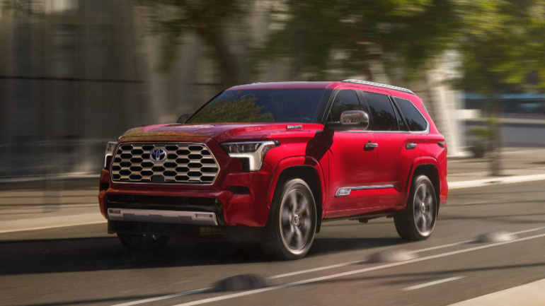 2024 Toyota Sequoia in red running with side view