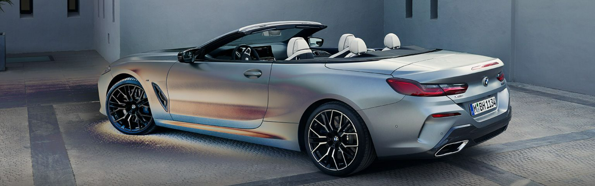 2025 BMW 8 Series Convertible in grey parking with rear view and side view-Banner