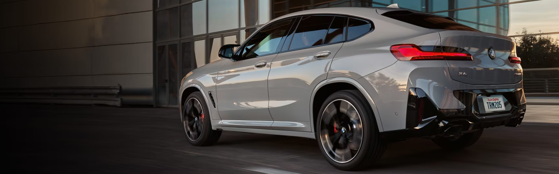 2025 BMW X4 running with rear and side view-banner