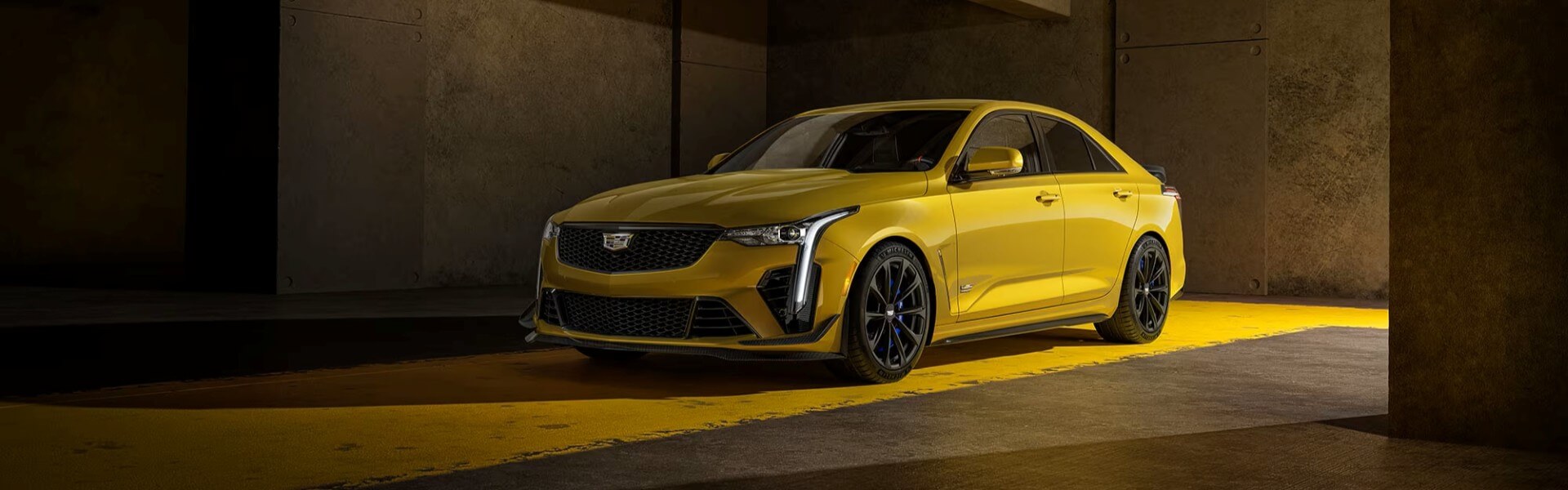 2025 Cadillac CT4-V In Yellow Parked In A Garage Banner