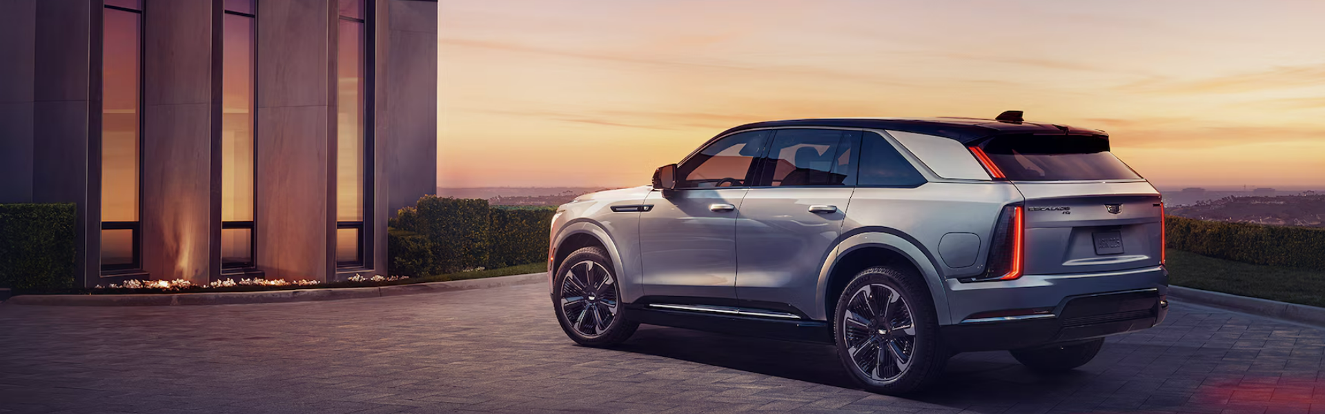 2025 Cadillac Escalade IQ in grey with side view Banner
