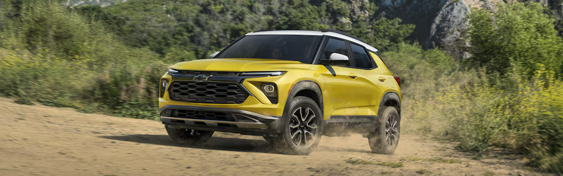 2025 Chevrolet Trailblazer driving on a dirt road in a rugged-Banner
