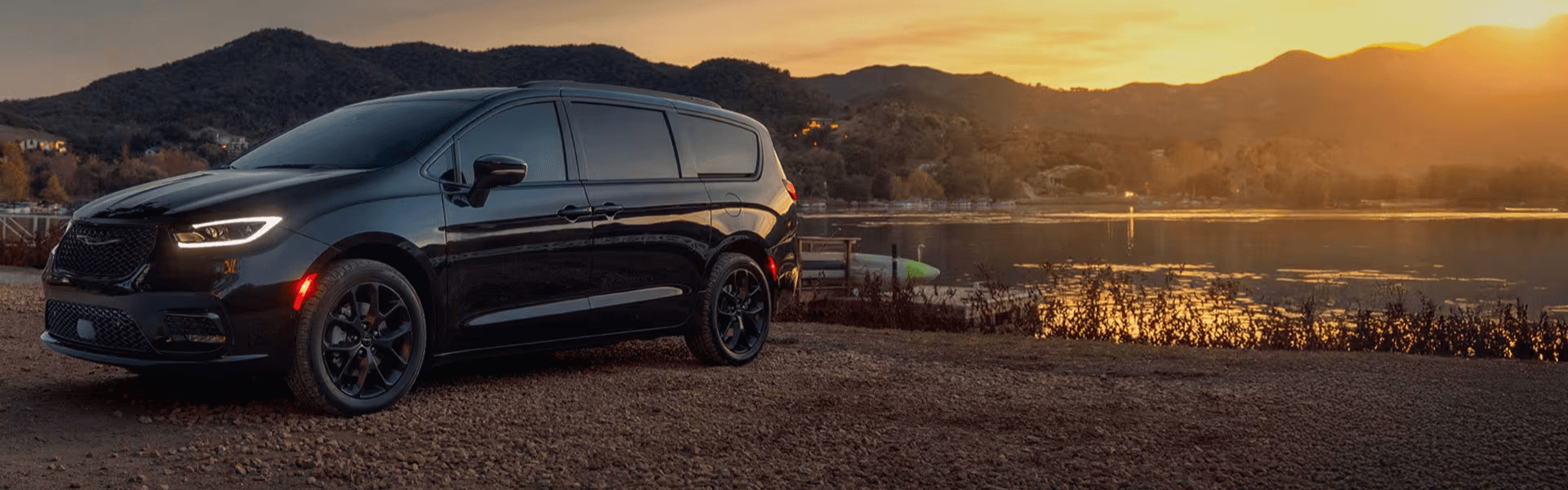 2025 Chrysler Pacifica Limited Parked By A Lake At Sunset Banner
