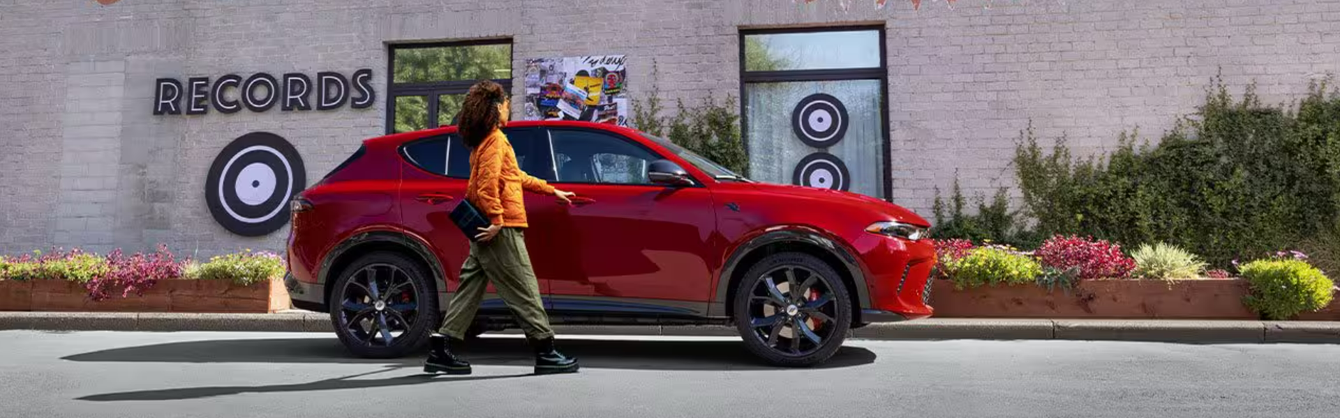 2025 Dodge Hornet RT parked along a sidewalk-Banner