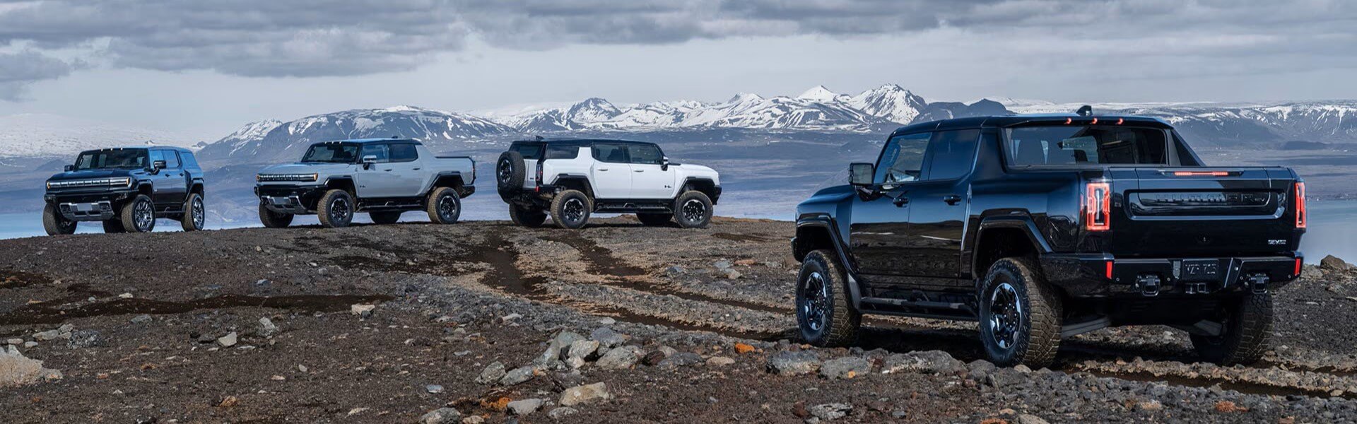 2025 GMC Hummer EV Models On Top Of A Mountain Banner