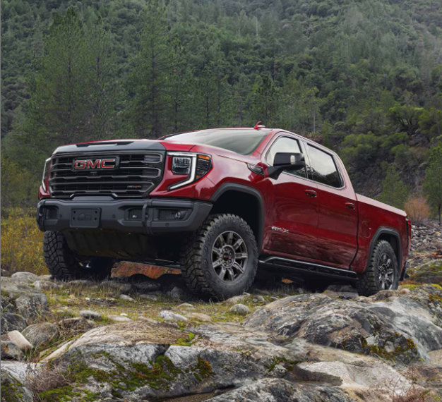 2025 GMC Sierra 1500 parked near rocks with a mountainous, forested backdrop-Features