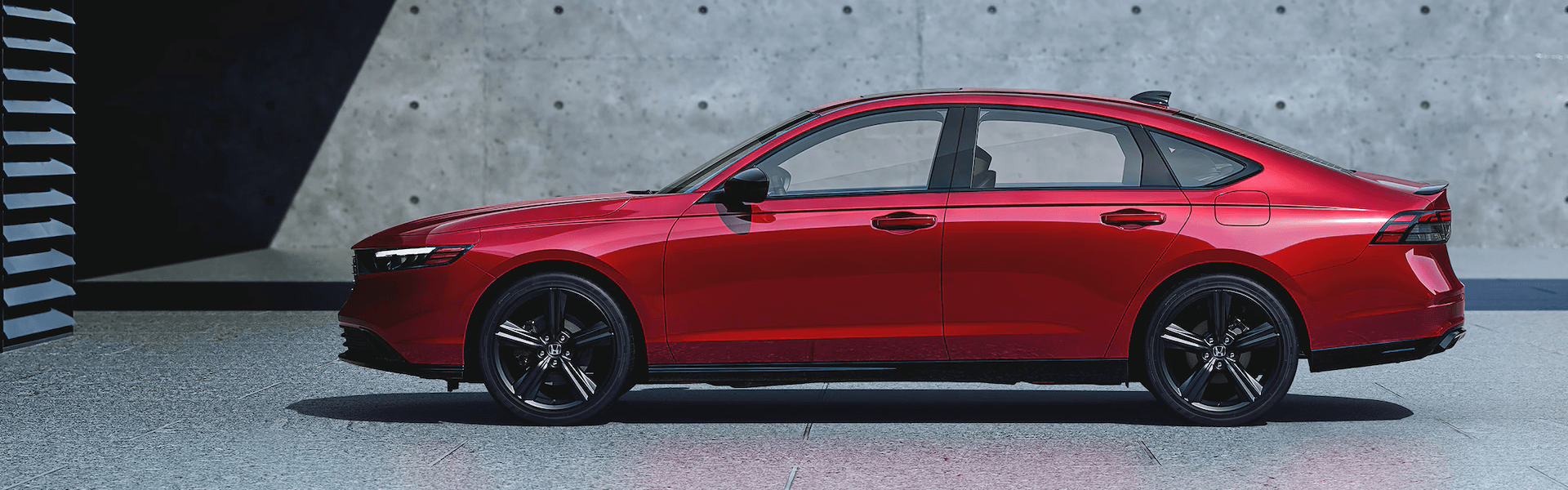 2025 Honda Accord Hybrid in Red Amid Brutalist Architecture Banner