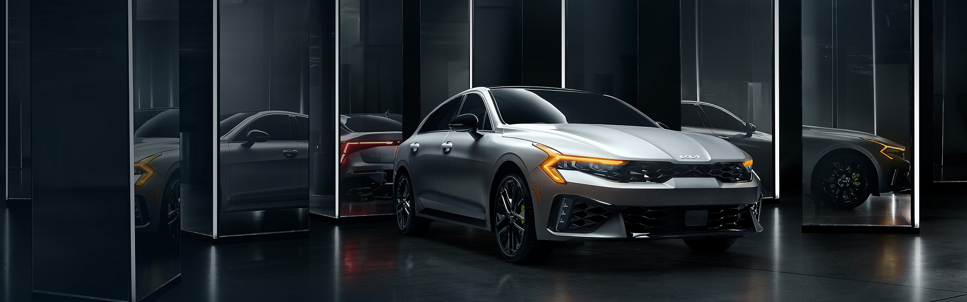2025 Kia is grey with side view and front view-Banner