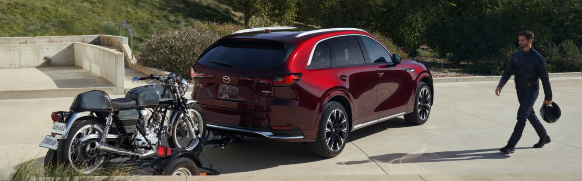 2025 Mazda CX-90 PHEV towing a motorcycle on a trailer-Banner