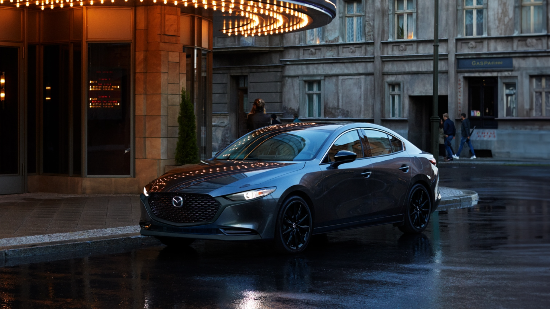 2025 Mazda3 Sedan parked with front and side view-Features
