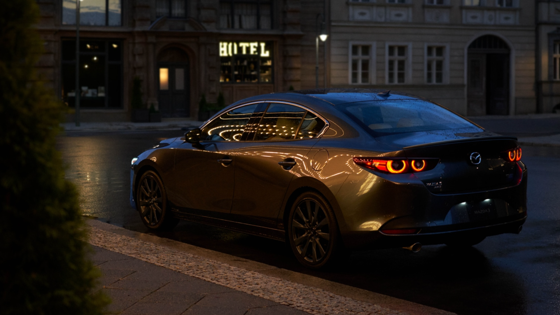 2025 Mazda3 Sedan parked with rear and side view-Features