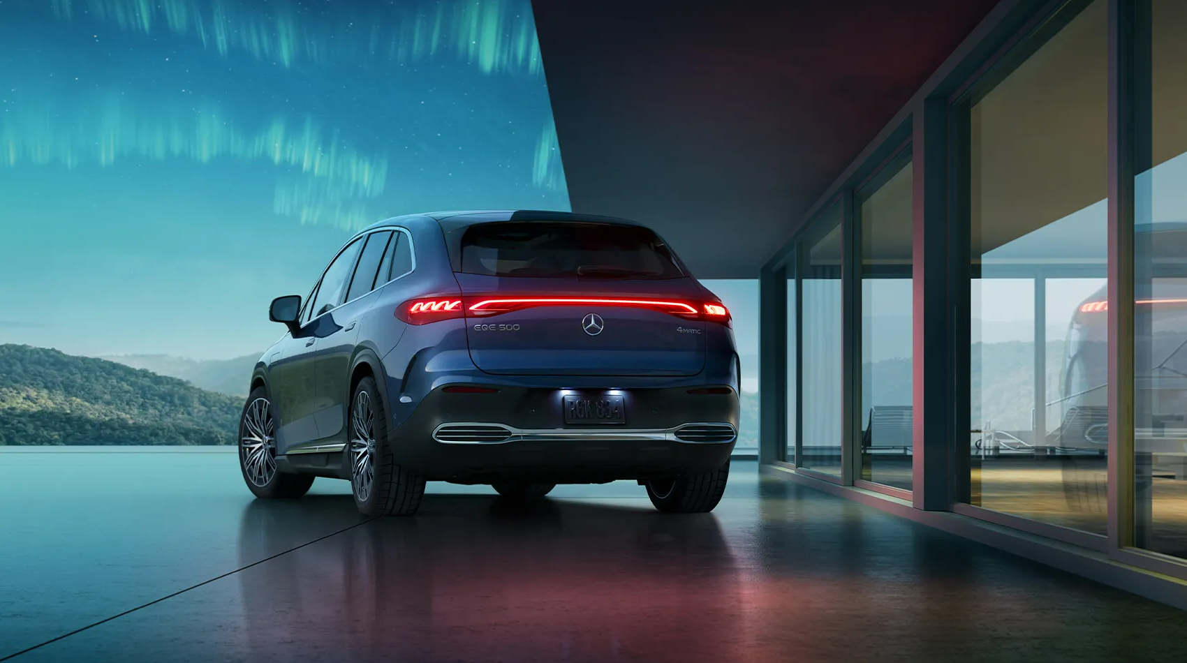 2025 Mercedes-Benz EQE parked near a modern building with large glass windows