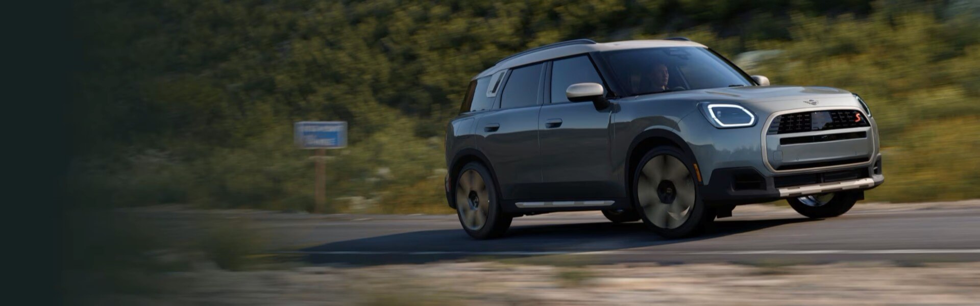 2025 MINI Countryman S ALL4 Driving Past Greenery Banner