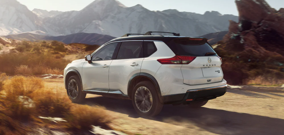 2025 Nissan Rogue driving through a rugged, mountainous landscape-Features