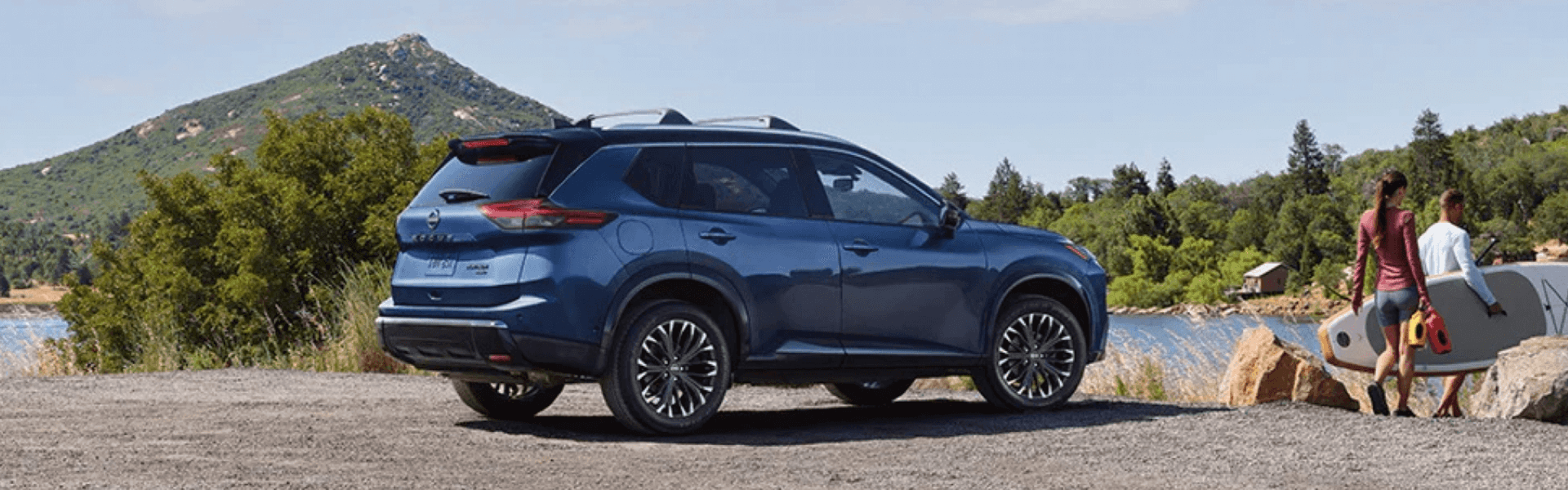 2025 Nissan Rogue parking near a lake with side view-For Sale