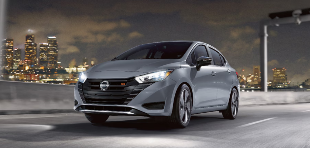 2025 Nissan Versa is gray running with front view-Features
