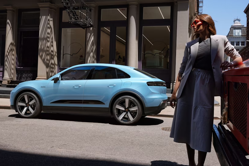 2025 Porsche Macan in blue parking on the street