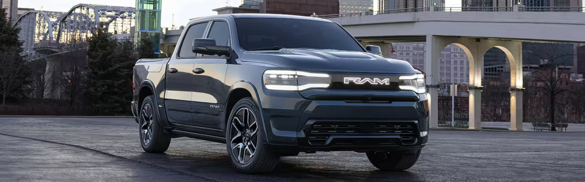 2025 Ram 1500 REV parked with front view-banner