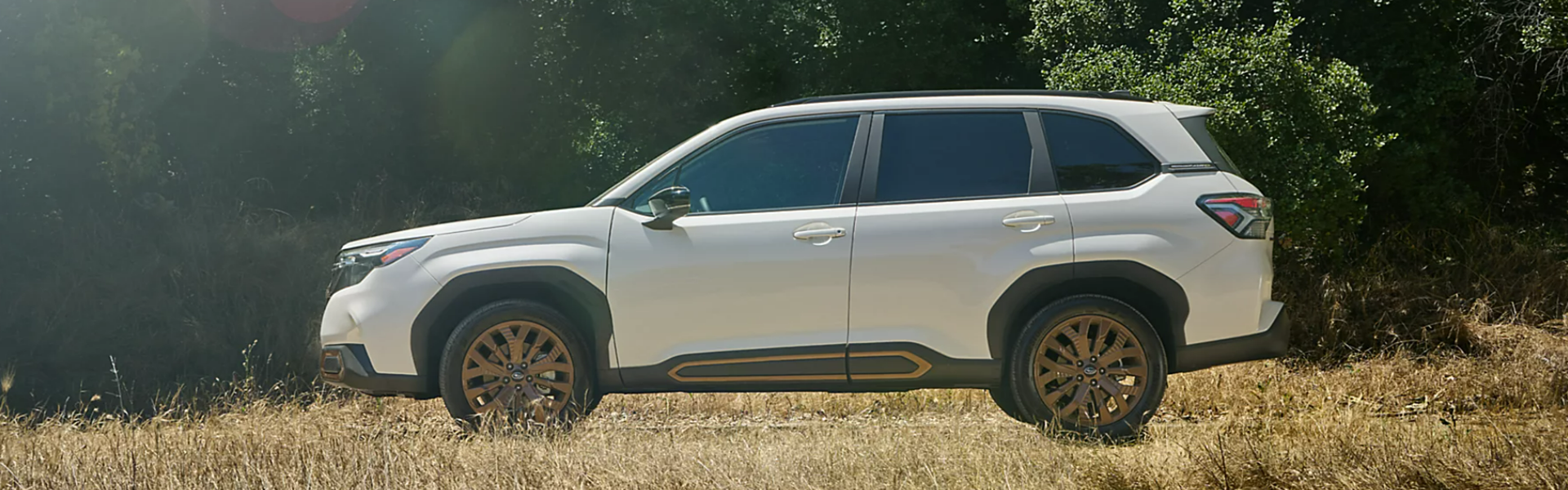 2025 Subaru Forester in white with side view - banner