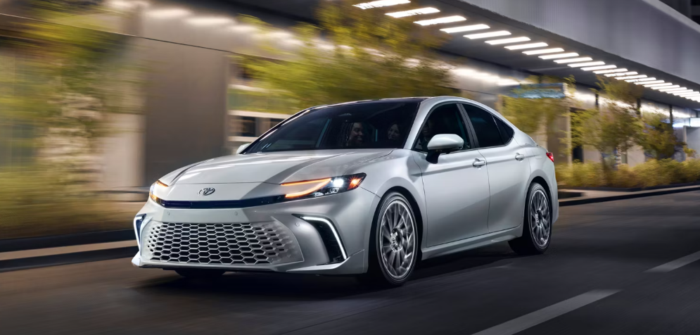 2025 Toyota Camry in a white is captured in both side and front views-Features