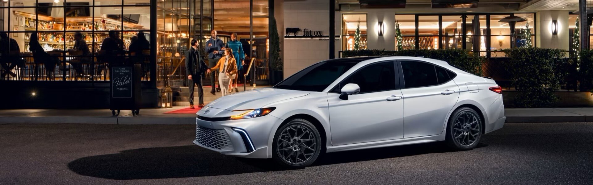 2025 Toyota Camry is white parking with side view-For Sale