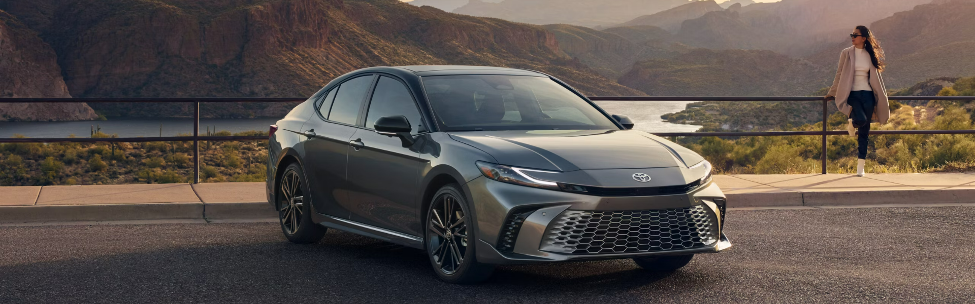 2025 Toyota Camry with a beautiful landscape of mountains and a lake in the background FOR SALE