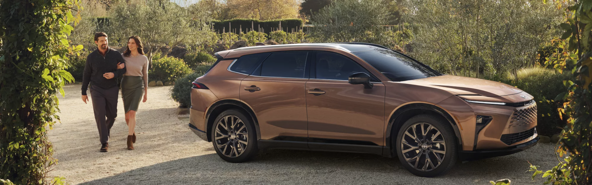 2025 Toyota Crown Signia parking outdoor couple getting to the vehicle