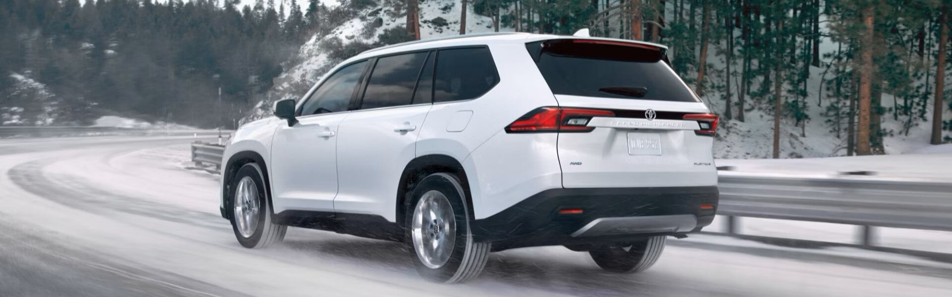 2025 Toyota Grand Highlander Platinum AWD Driving In The Snow Banner
