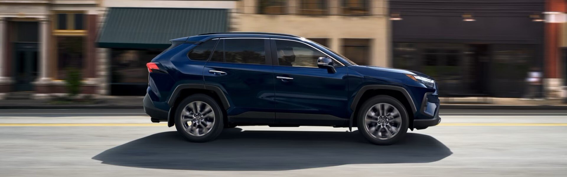 2025 Toyota RAV4 Limited In Blueprint Driving Past Buildings For Sale