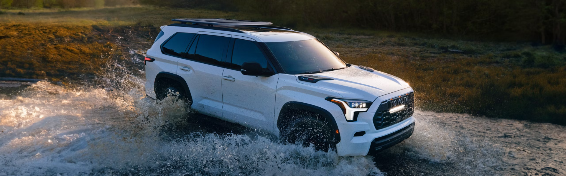 2025 Toyota Sequoia in white driving through the stream-banner