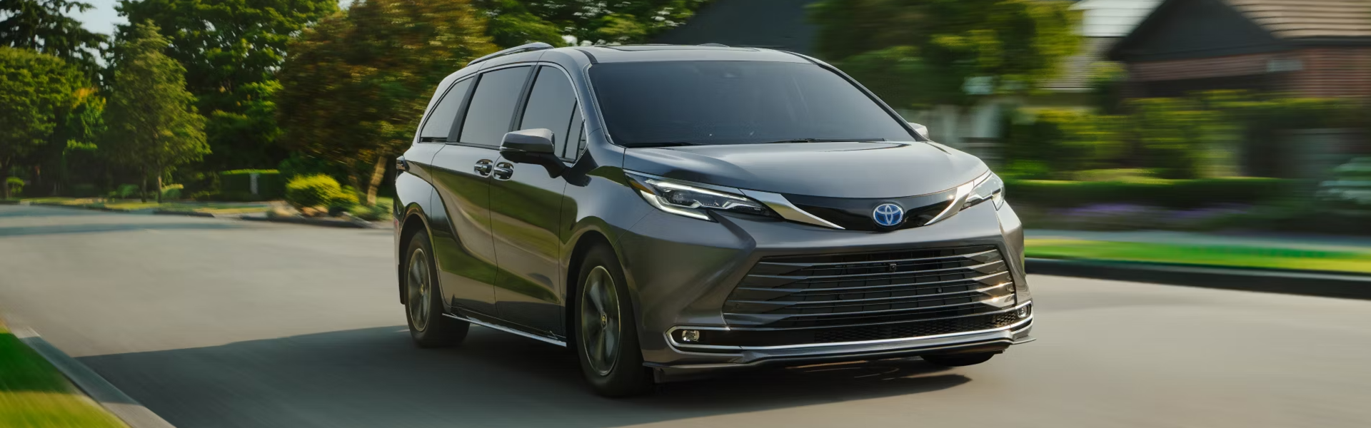 2025 Toyota Sienna Driving On A Street Banner