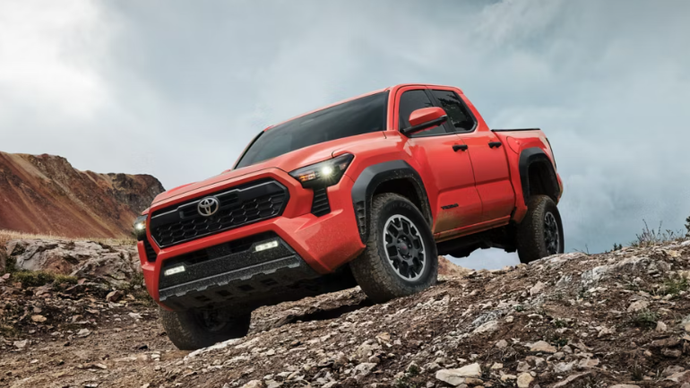 2025 Toyota Tacoma running with front view-Feature