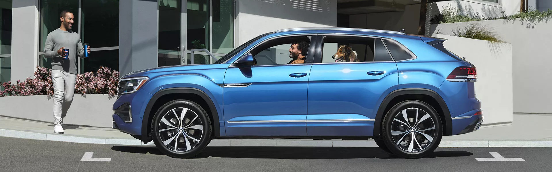 2025 Volkswagen Atlas Cross Sport in blue with side view-banner
