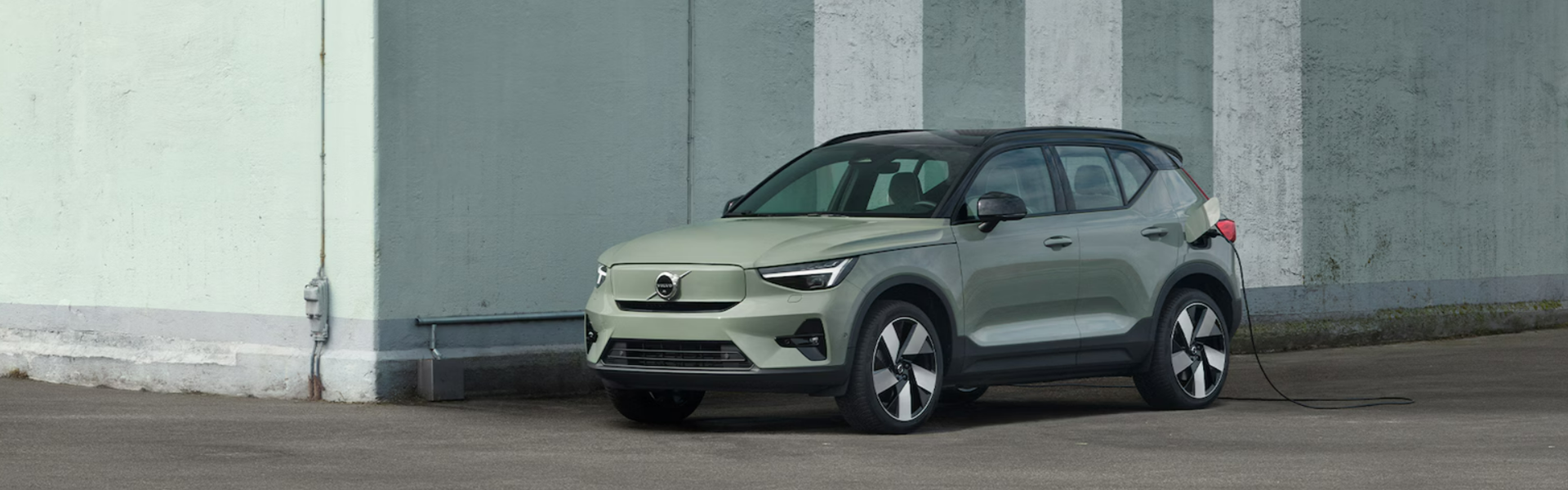 2025 Volvo EX40 charging with front view and side view-Banner