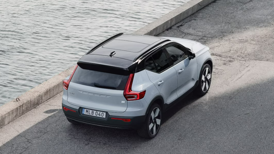 2025 Volvo EX40 in white parking with top view and side view