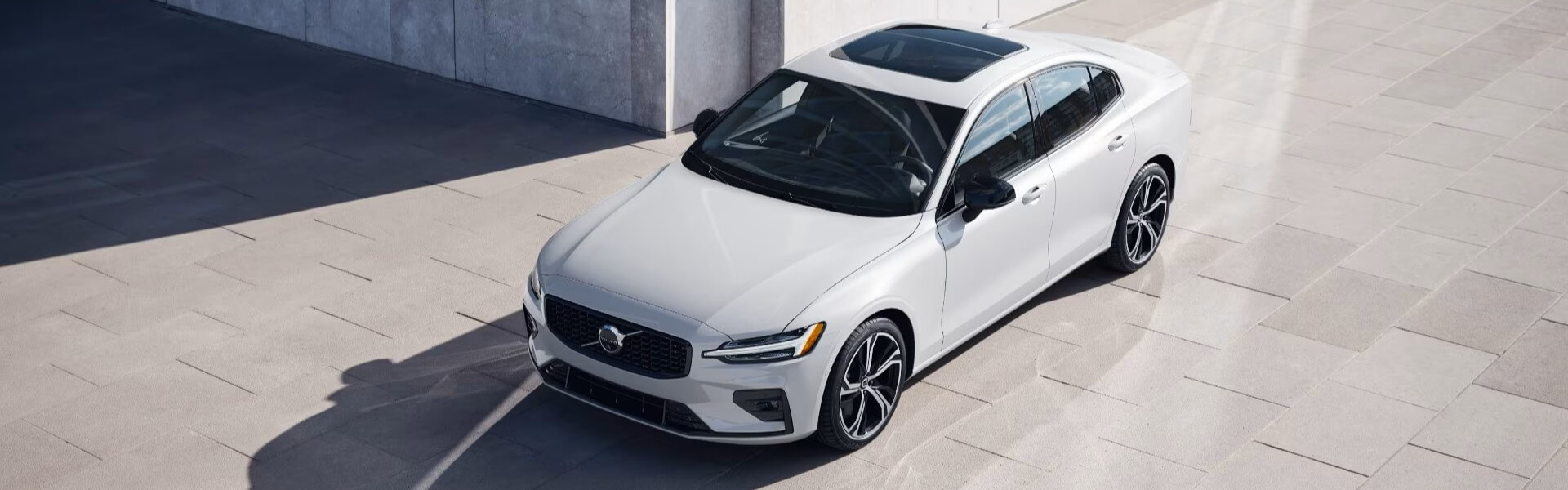 2025 Volvo S60 Parked In Crystal White Banner