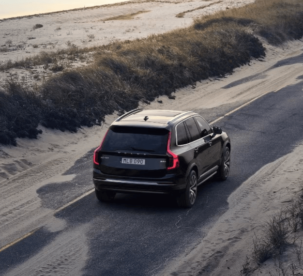 2025 Volvo XC90 Driving Down The Road - Feature Image