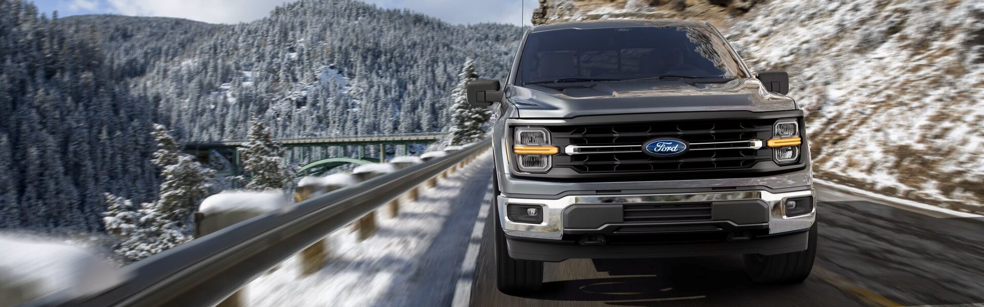 2026 Ford F-150 driving down a snowy mountain road Banner