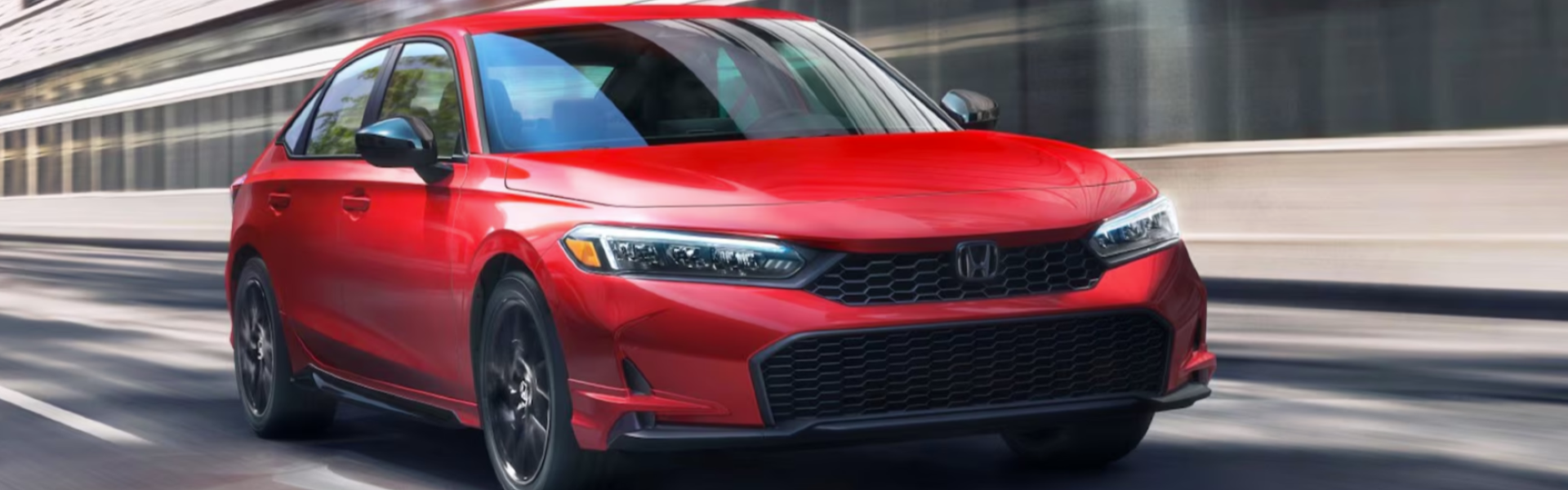 2026 Honda Civic Sedan driving in the city quickly Banner
