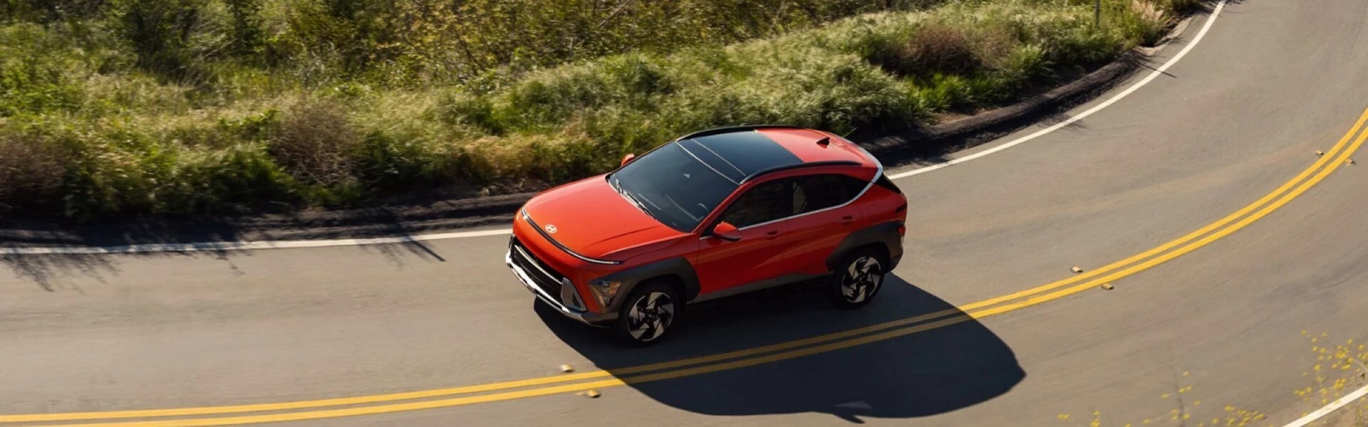2026 Hyundai Kona Banner driving up a mountain road