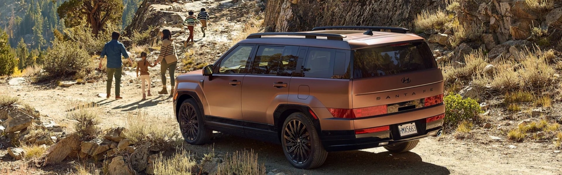 2026 Hyundai Santa Fe on a desert mountain road with a family For Sale