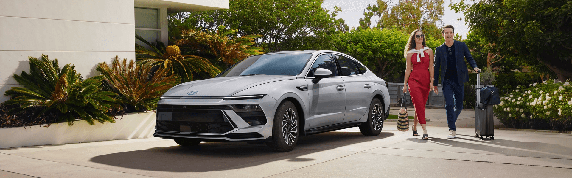 2026 Hyundai Sonata Chic Couple Outside Upscale Modern House Banner.png
