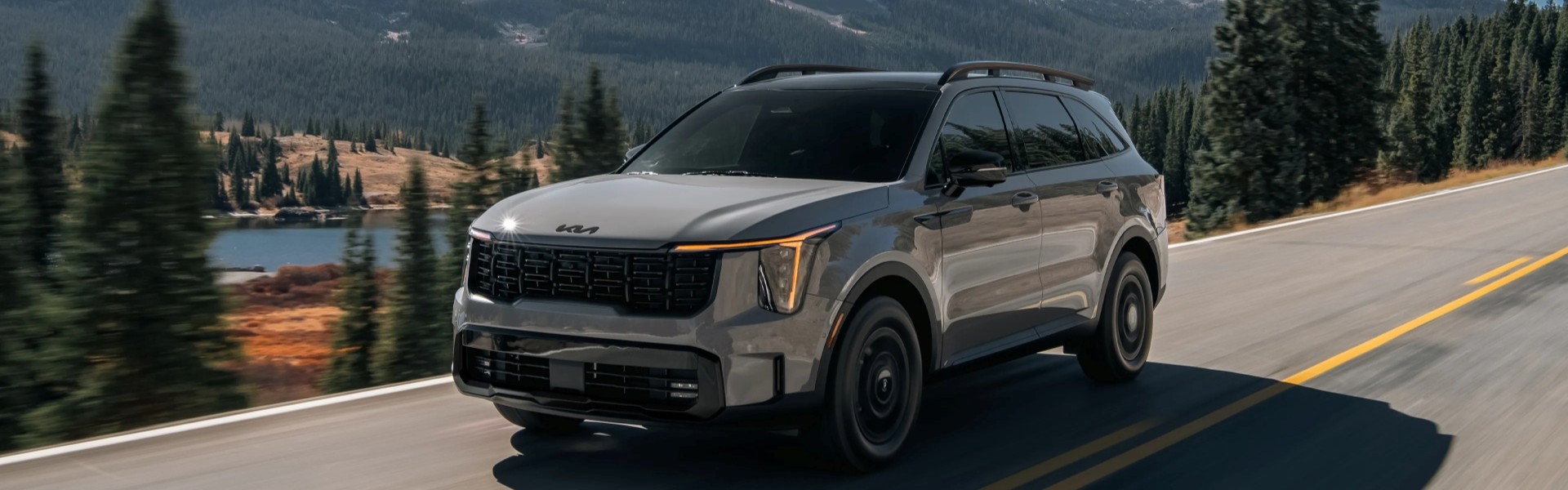 2026 Kia Sorento driving in a valley next to a lake For Sale