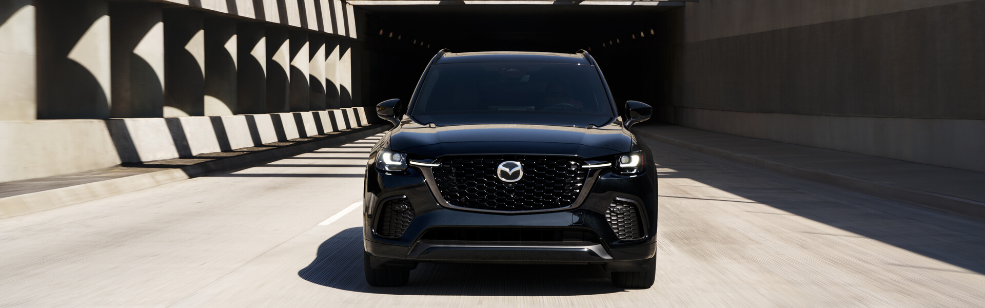 2026 Mazda CX-70 Driving Surrounded By Brutalist Concrete Banner