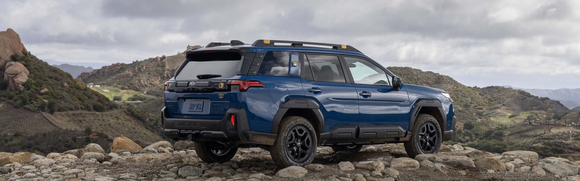 2026 Subaru Outback Wilderness Atop Some Rocks Banner